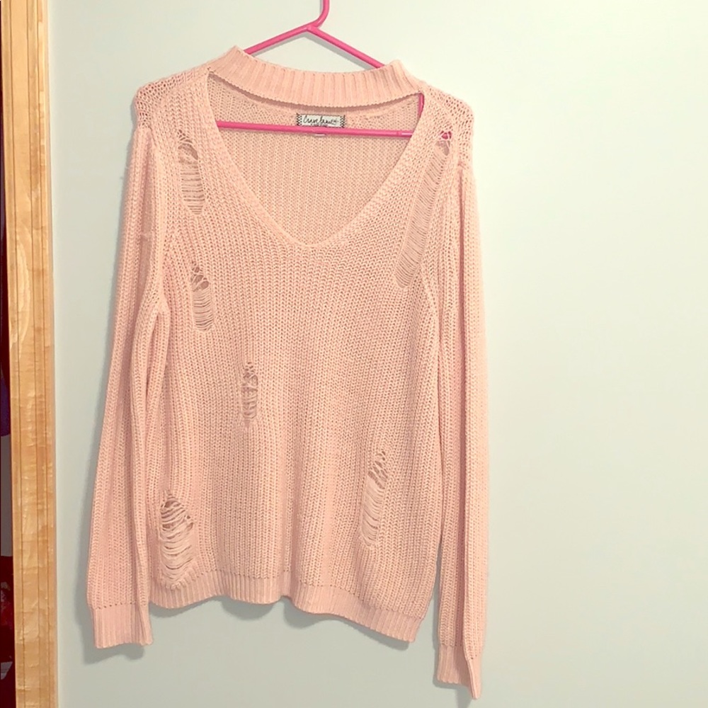 Distressed cut out sweater